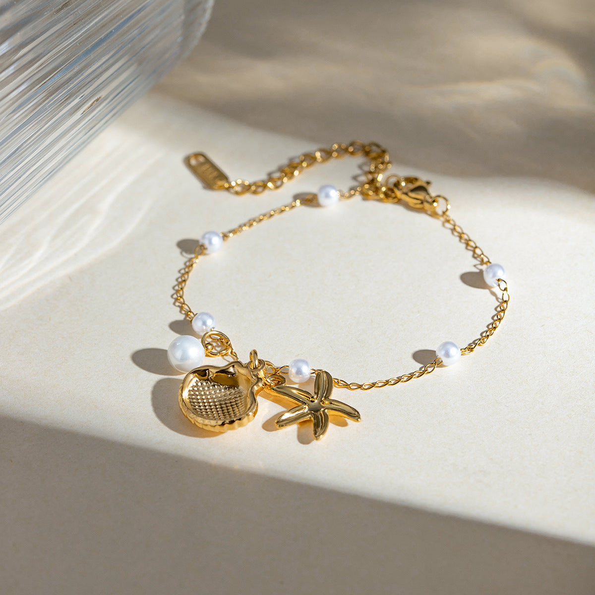 Bracelet tendance avec pendentif en forme d'étoile de mer et coquillage, chaîne en acier inoxydable et or 18 carats, idéal pour les vacances d'été