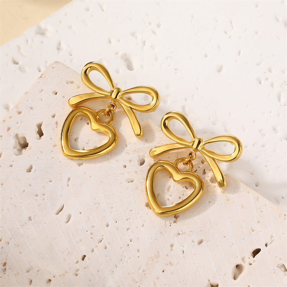 Boucles d'oreilles en forme de cœur avec chaîne et lame en acier inoxydable et nœud en perles