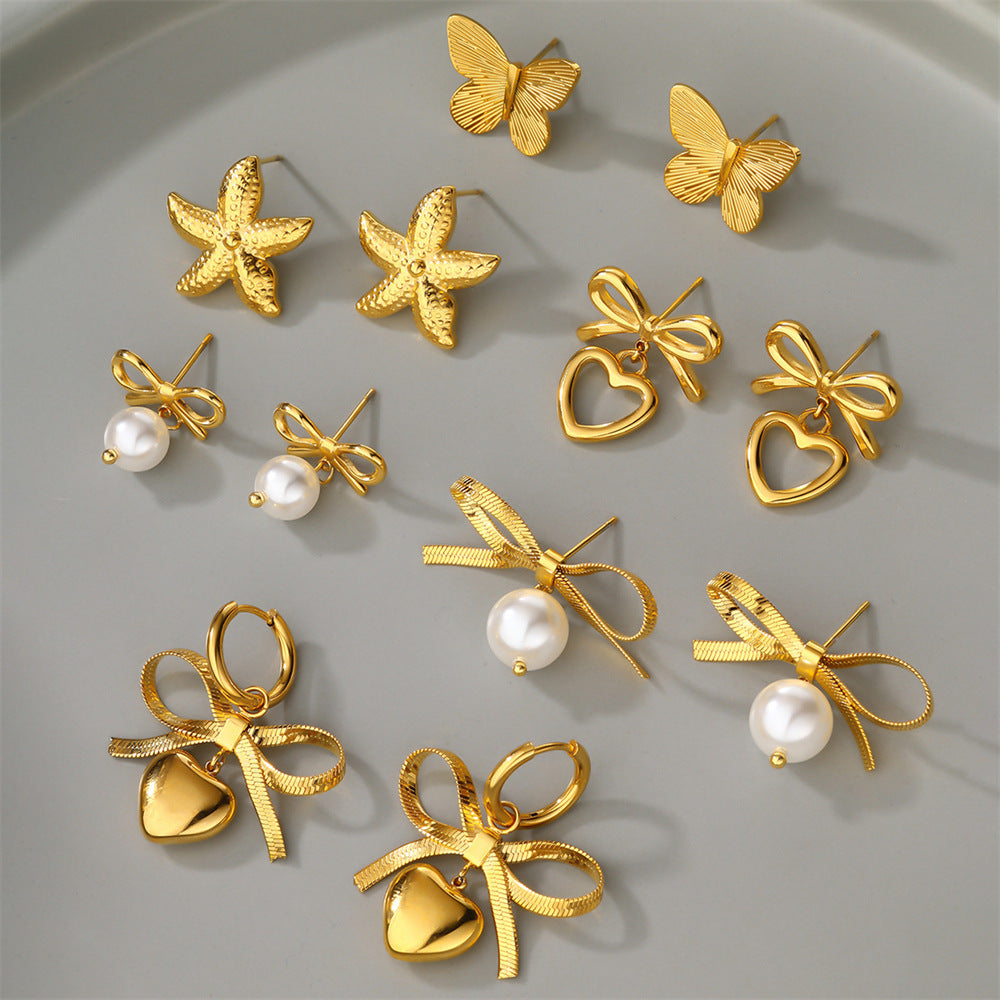 Boucles d'oreilles en forme de cœur avec chaîne et lame en acier inoxydable et nœud en perles