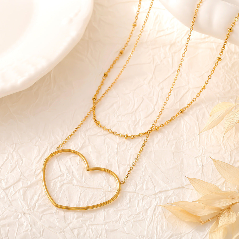 Collier européen et américain à double clavicule creuse en acier inoxydable plaqué or 18 carats