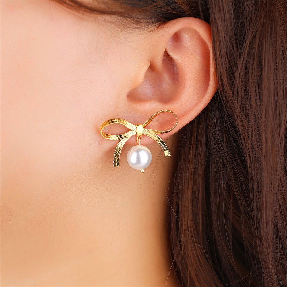 Boucles d'oreilles en forme de cœur avec chaîne et lame en acier inoxydable et nœud en perles