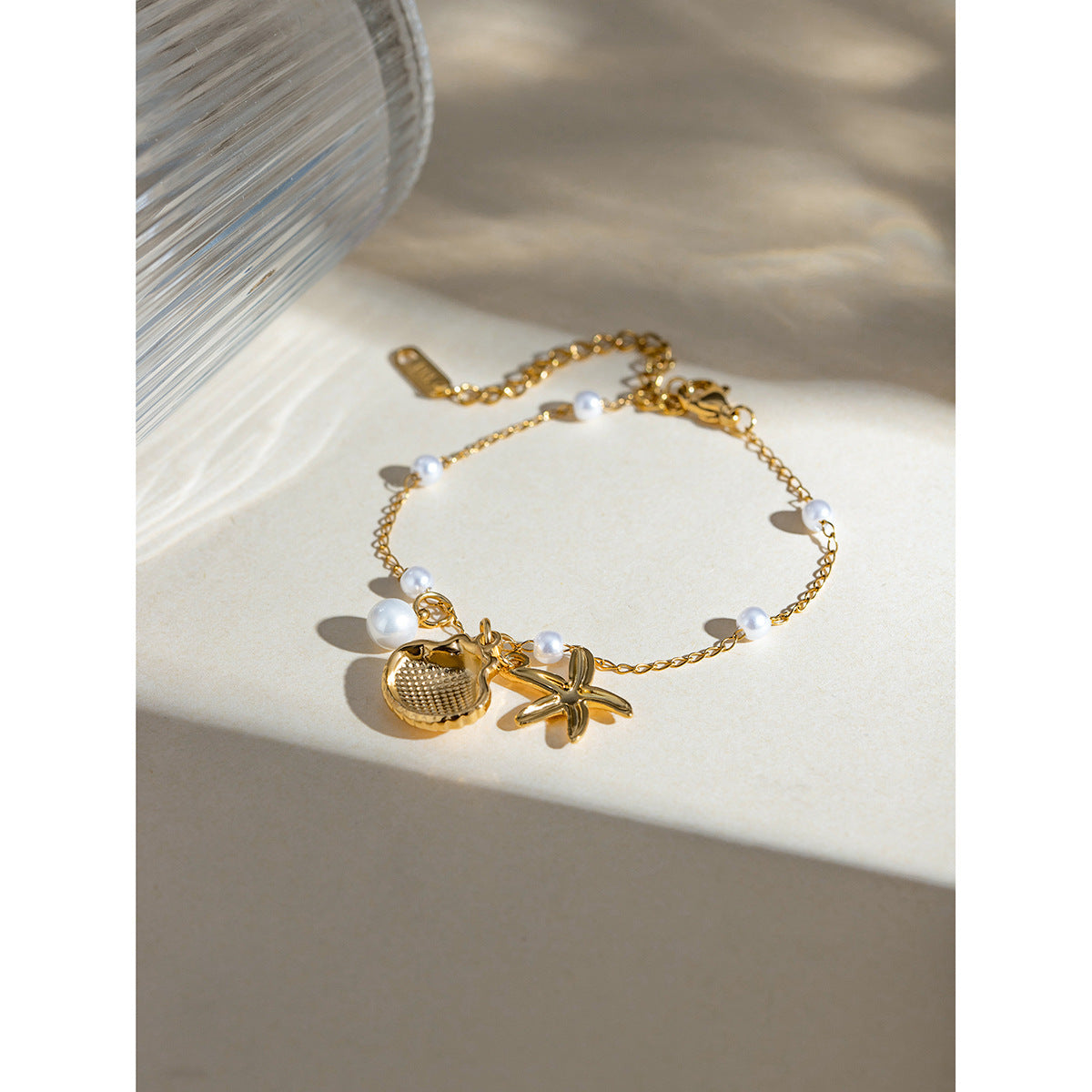 Bracelet tendance avec pendentif en forme d'étoile de mer et coquillage, chaîne en acier inoxydable et or 18 carats, idéal pour les vacances d'été