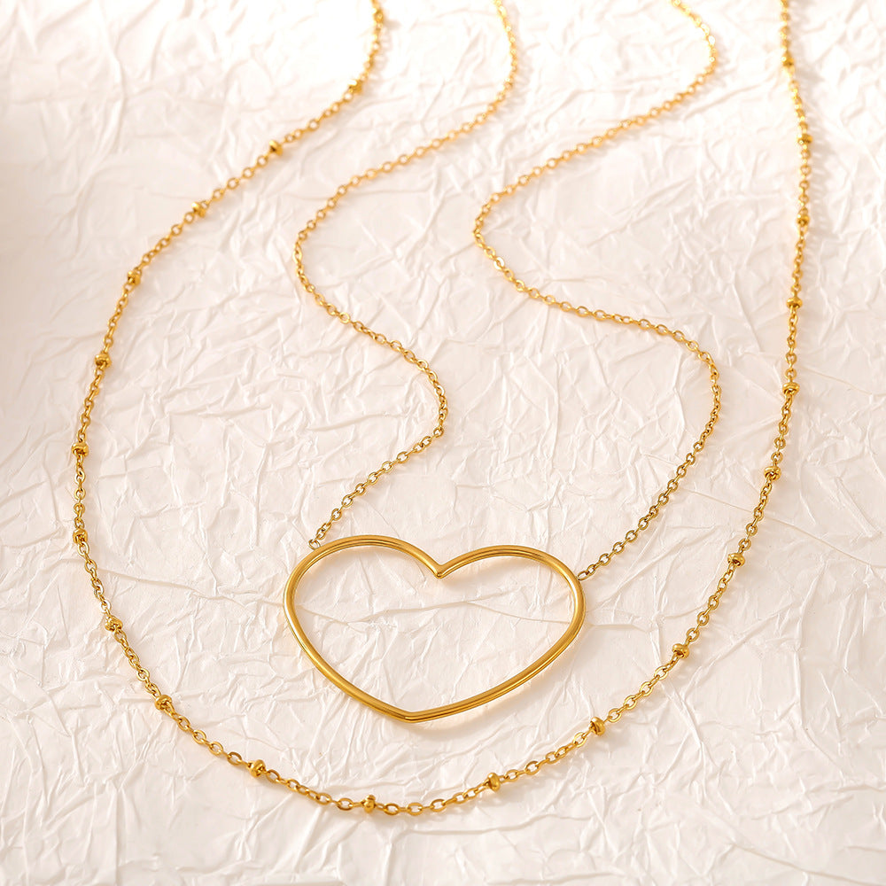 Collier européen et américain à double clavicule creuse en acier inoxydable plaqué or 18 carats
