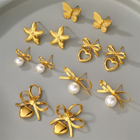 Boucles d'oreilles en forme de cœur avec chaîne et lame en acier inoxydable et nœud en perles
