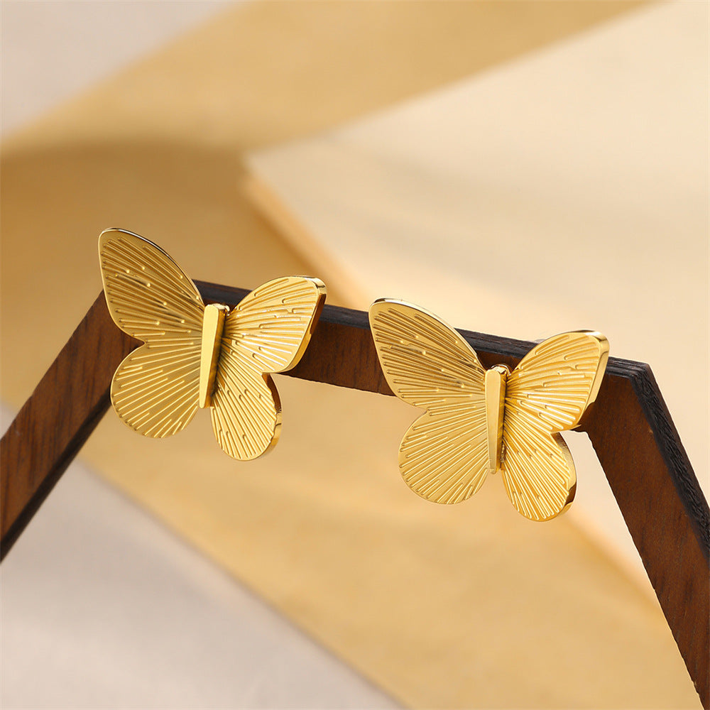 Boucles d'oreilles en forme de cœur avec chaîne et lame en acier inoxydable et nœud en perles