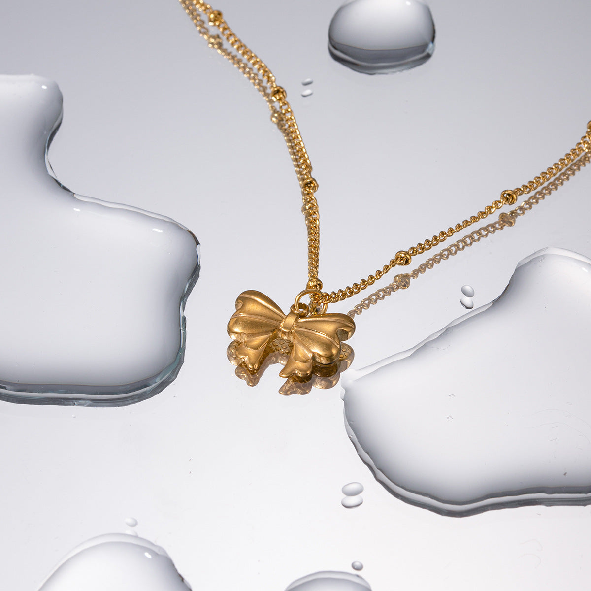 Collier pendentif papillon en acier inoxydable doré 18 carats, exquis et léger