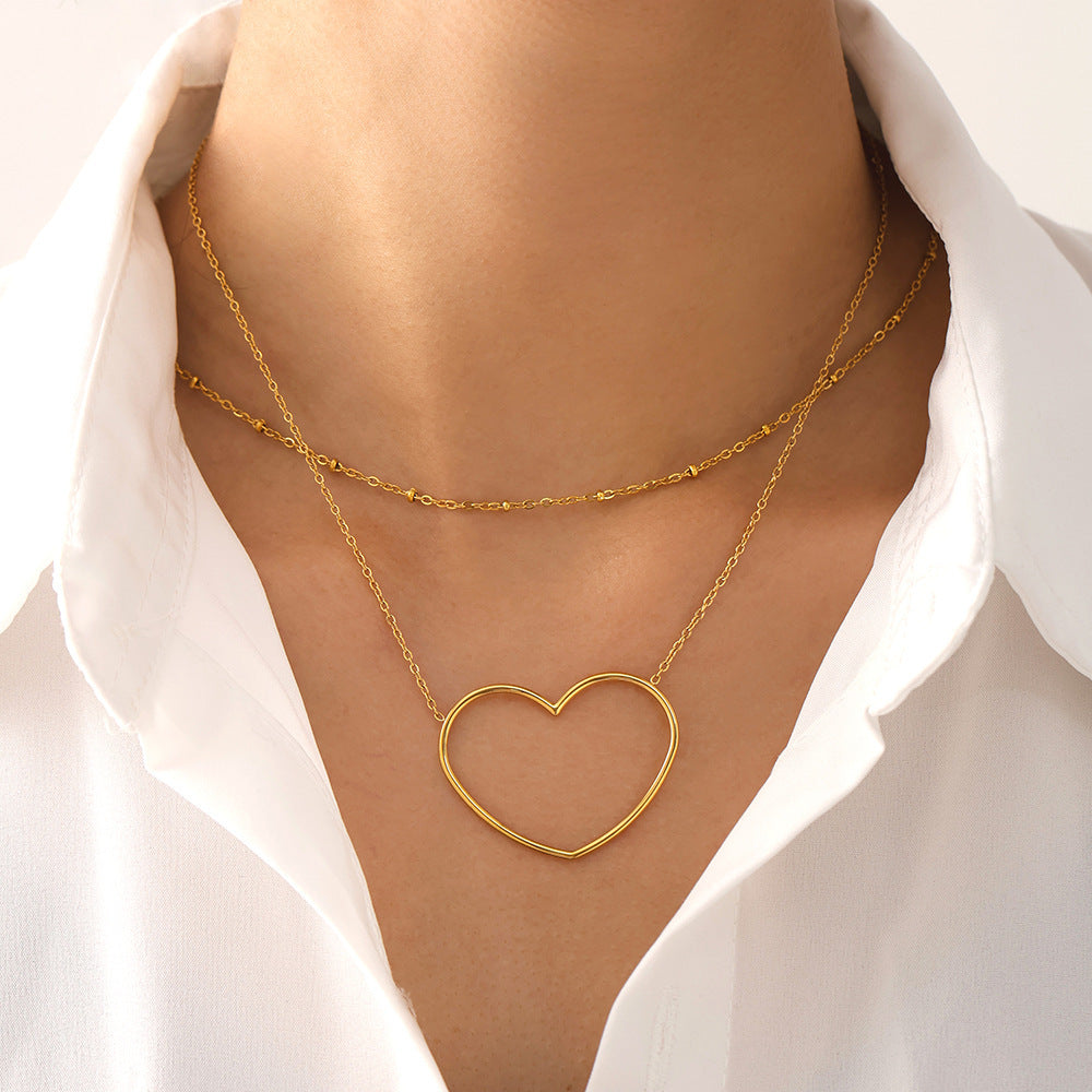 Collier européen et américain à double clavicule creuse en acier inoxydable plaqué or 18 carats